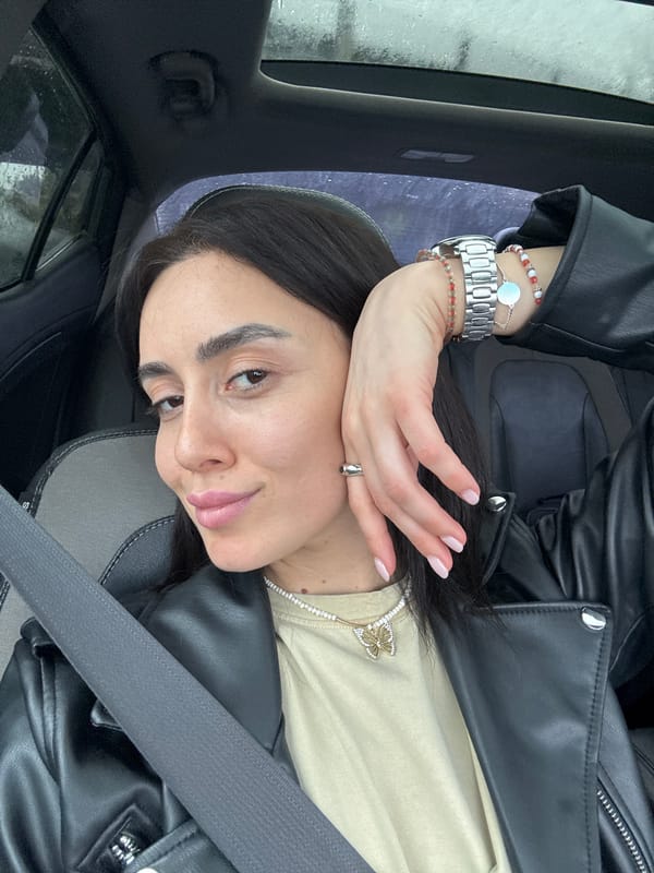 Woman takes selfies during rainy car ride in Tbilisi