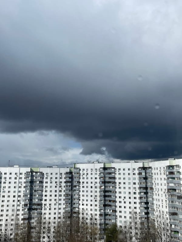 Moscow resident documents stormy morning, apartment building and shelf