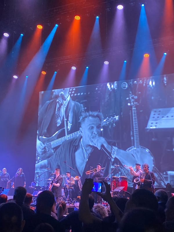 Rock band performs concert in Yekaterinburg with stage lighting