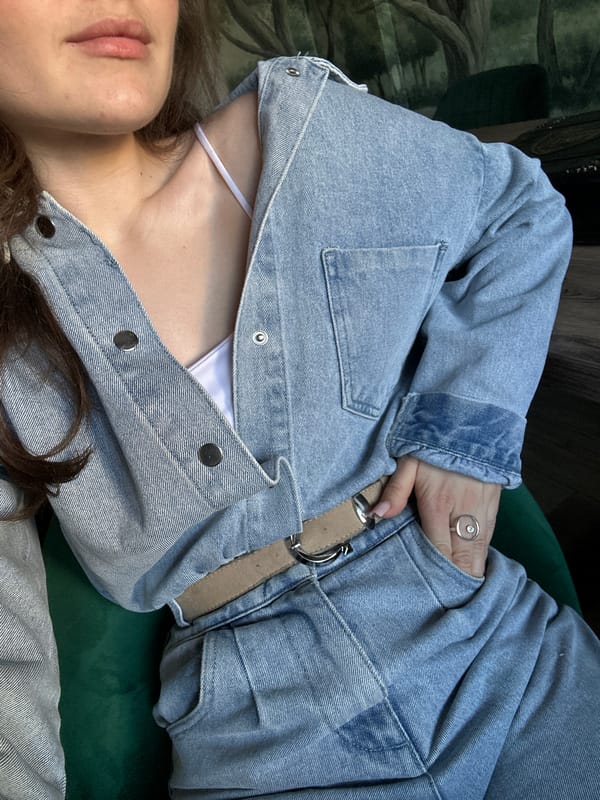 Woman poses with lipstick, relaxes on furniture in Ufa