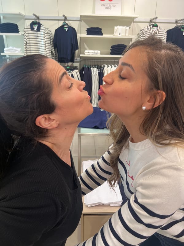 Friends pose for photos at Luxembourg clothing store