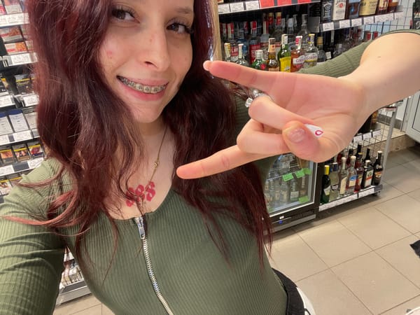 Woman takes selfies in Pernik shop early morning