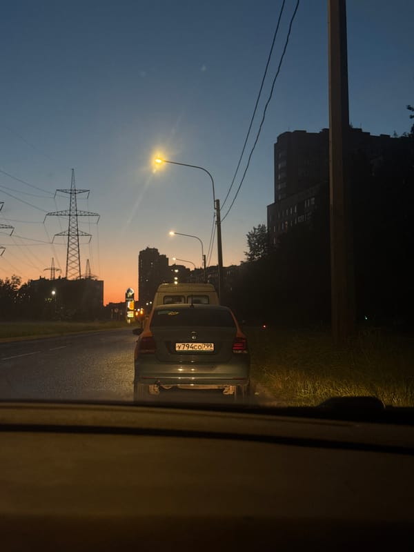Evening drive through Saint Petersburg, dashboard and city in frame