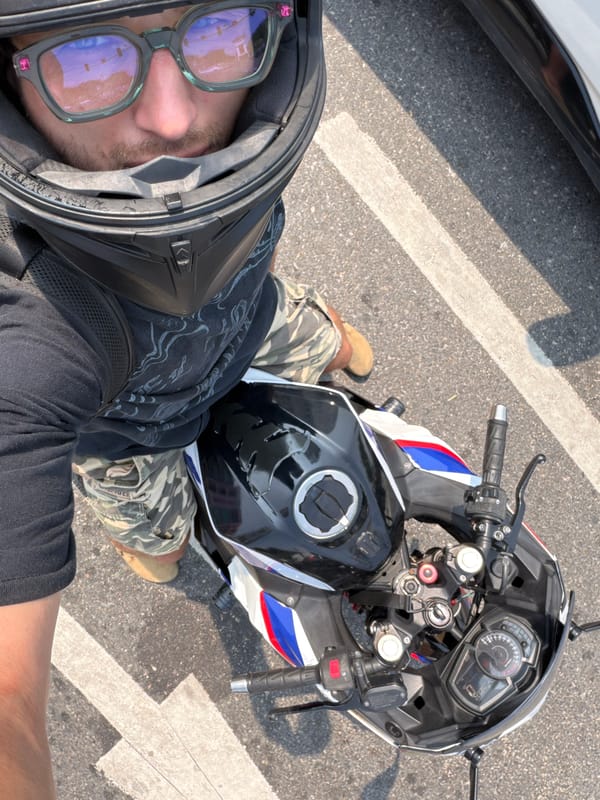 Helmeted motorcyclist spotted on marked pavement in Đà Nẵng