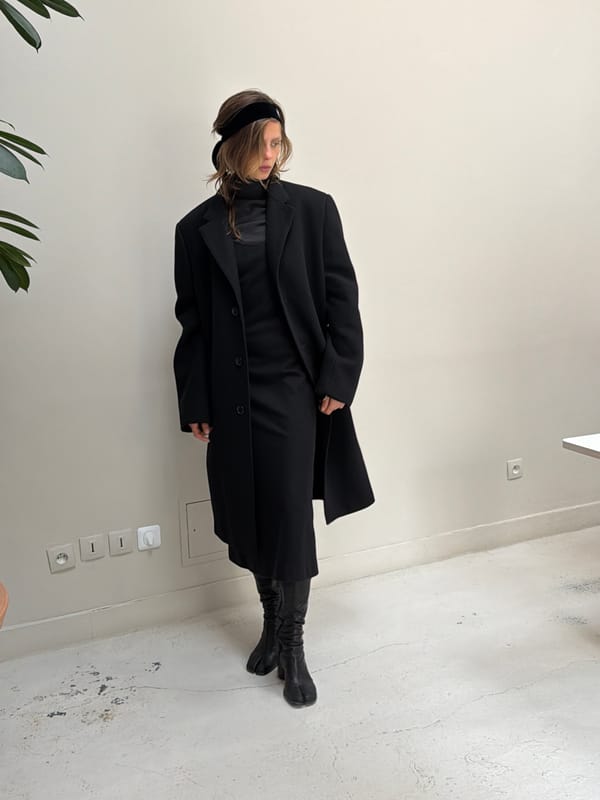 Two women gather near clothing storage area in Paris
