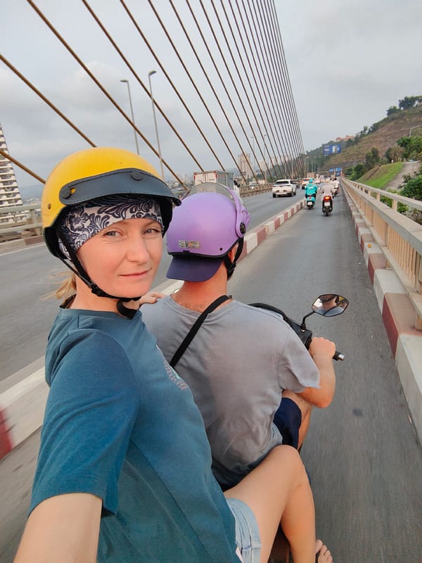 Scooter riders cross Bai Chay Bridge in Vietnam