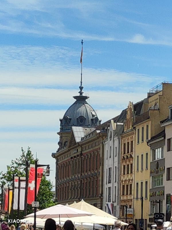 Summer morning in Konstanz's historic square with market and fountains