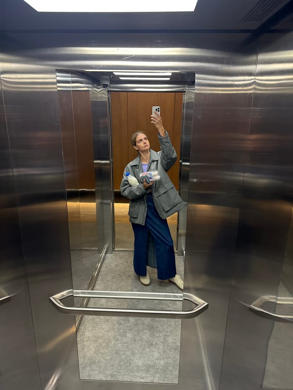 Woman Takes Multiple Selfies During Morning Elevator Ride