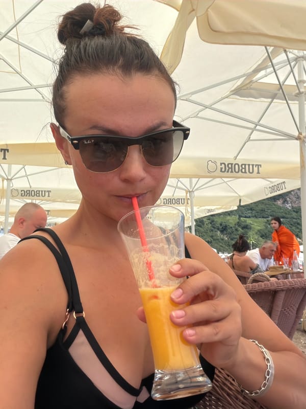 Orange juice and chill time at a Montenegrin beach cafe