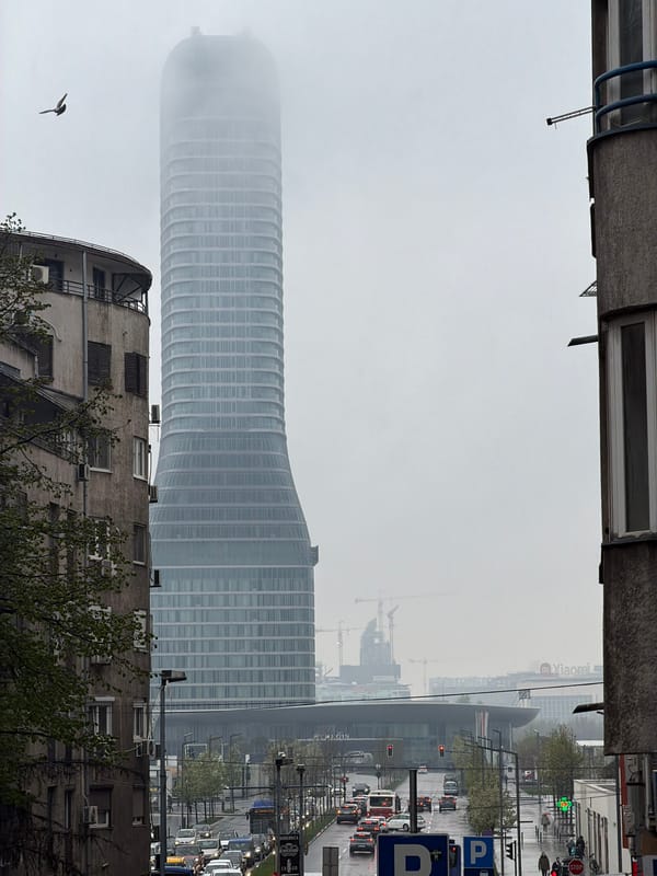 Foggy conditions obscure Belgrade skyline, modern tower visible