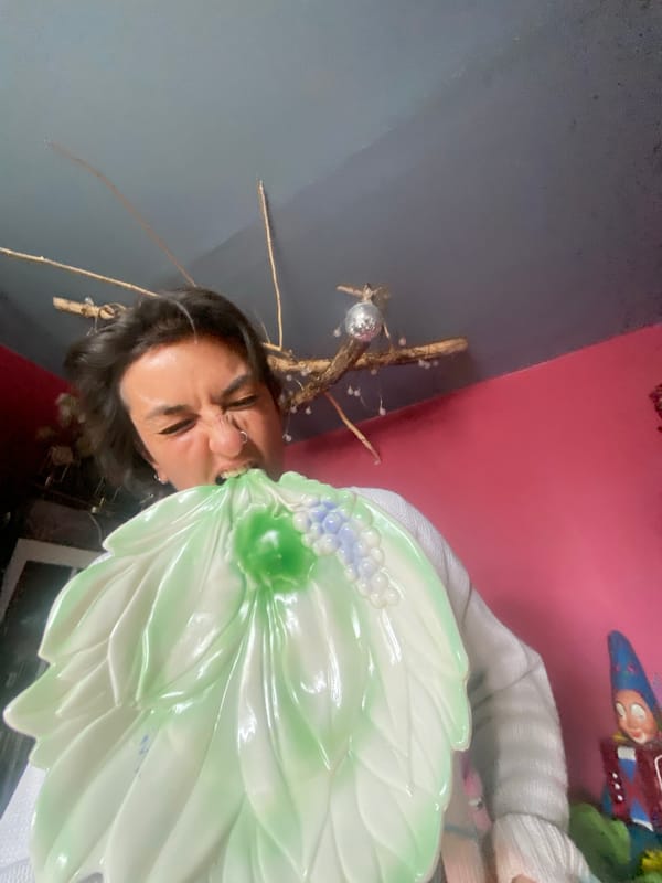 Person grimaces behind serving dish near Moscow high-rises