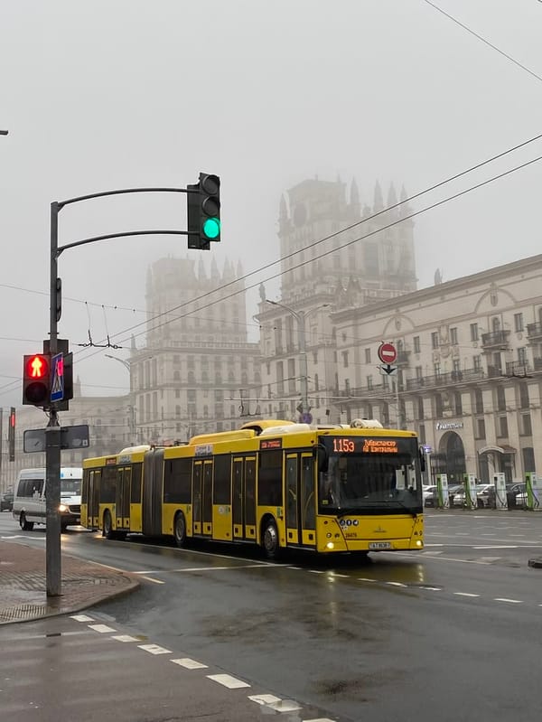 Trolleybus navigates wet Minsk streets during early morning commute