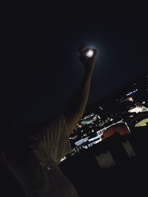 Full moon night over Veliko Tarnovo, hand reaching for the sky