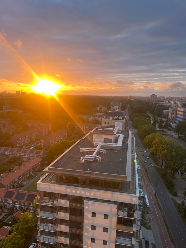 Aerial sunset views across city skyline from multiple angles