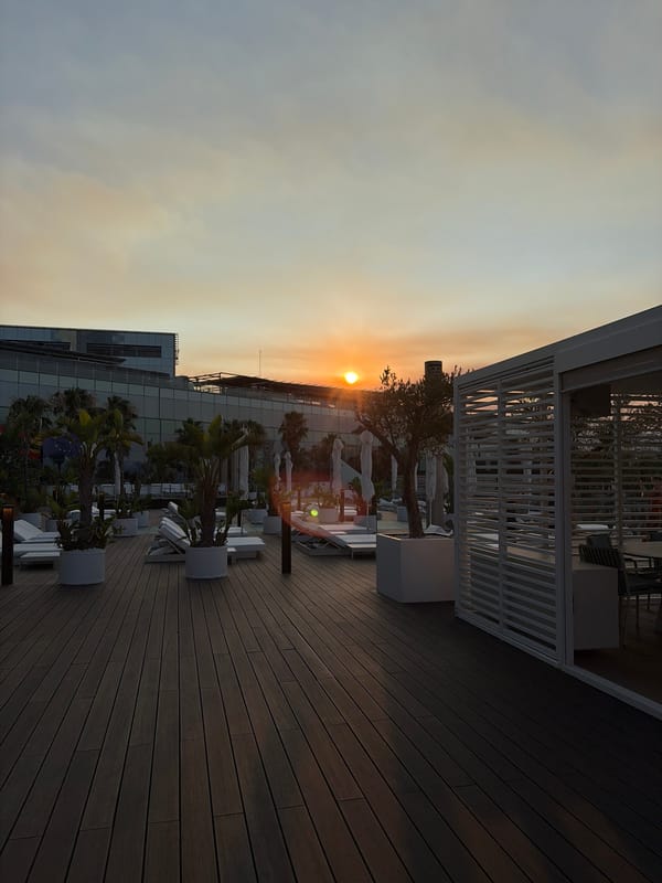 Sunset drinks at a Barcelona beach club rooftop