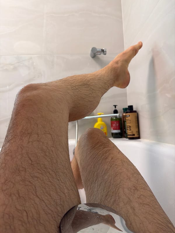 Person Takes Shower in Strelna, Russia