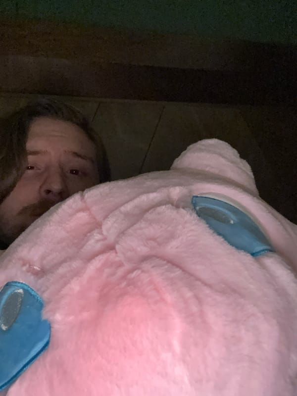 Person hides behind pink plush toy in Mexico