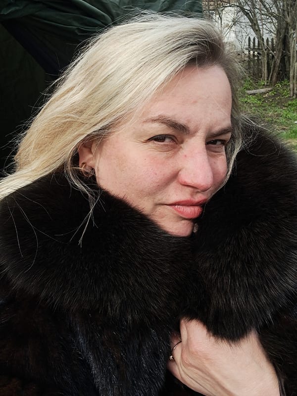Woman in fur observed with apple in Полянки, Russia