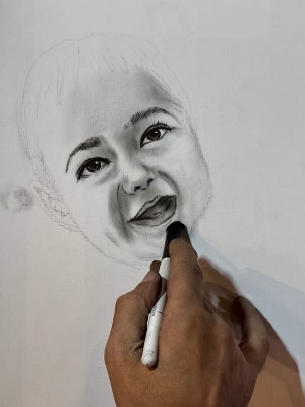 Artist draws portrait sketch in Eilat, Israel