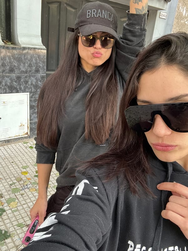 Women take selfies, dog walker spotted on Buenos Aires street