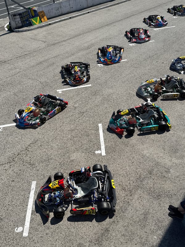 Go-kart lineup and drivers ready at a Ryazan track