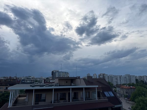 Dark storm clouds gather over urban area