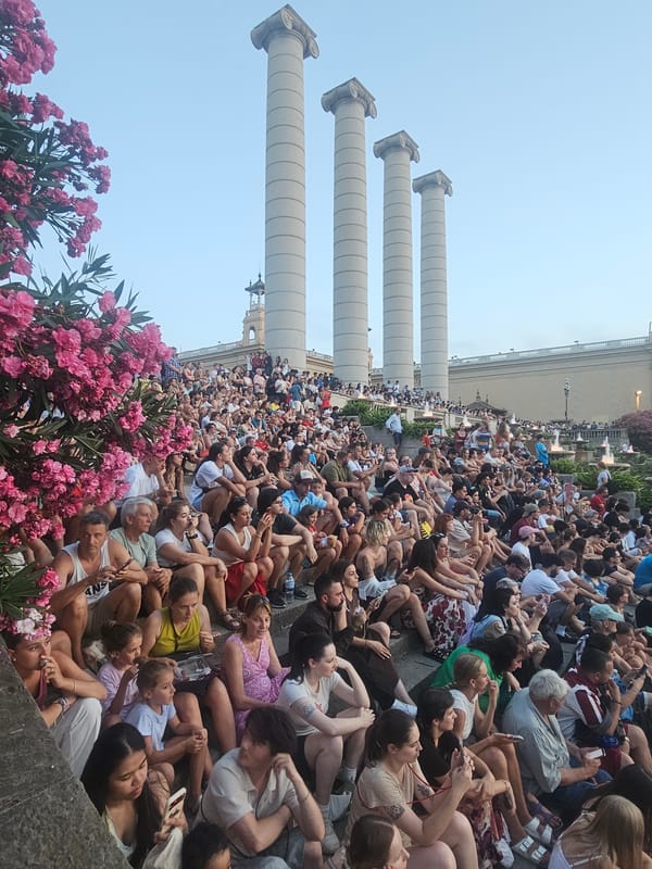 Evening crowd takes in the Magic Fountain light show in Barcelona