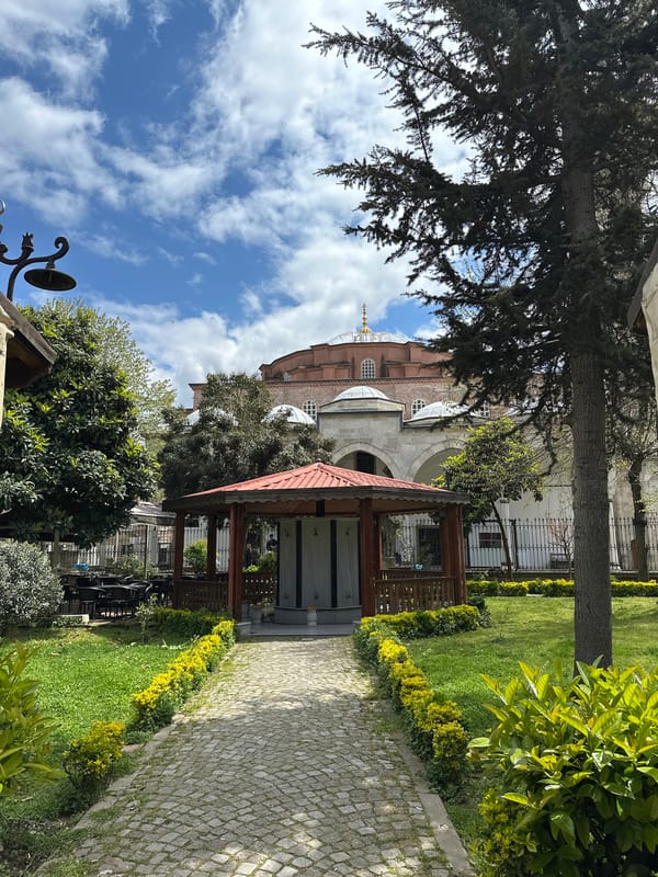Historic Istanbul site visited during sunny morning with helicopter overhead
