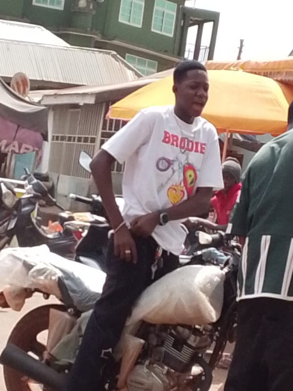 Street vendors transport goods by motorcycle in Tamale, Ghana