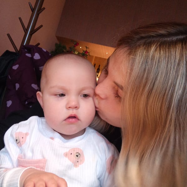 Family shares tender cafe moments with baby during morning outing