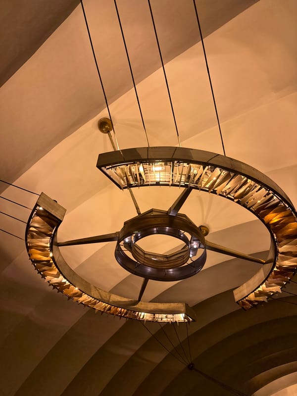 Saint Petersburg metro station's ornate chandelier and busy platform