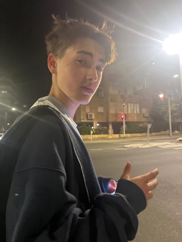 Young man photographed outdoors at night in Ramat Gan