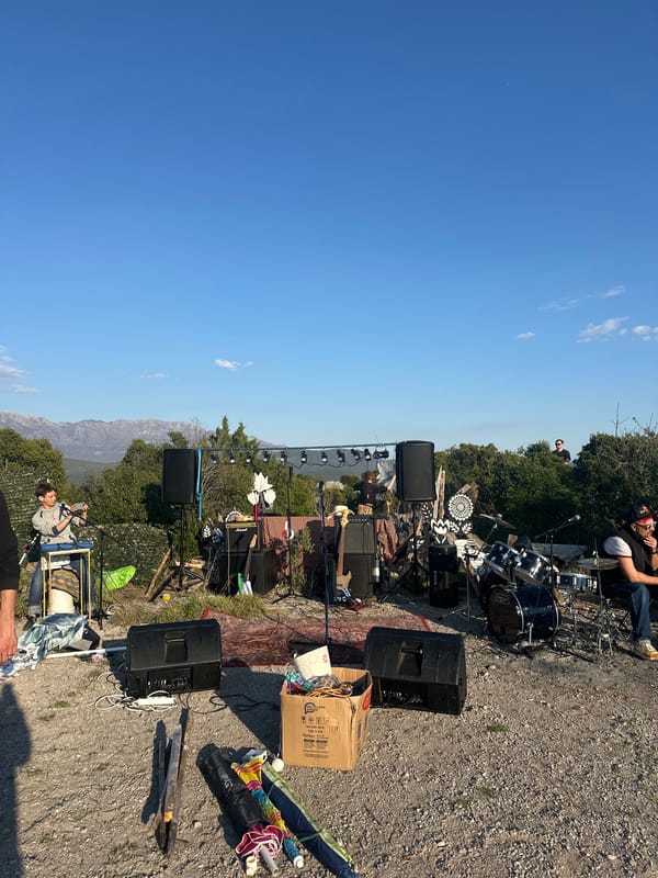 Outdoor music setup with art installations documented in Montenegro