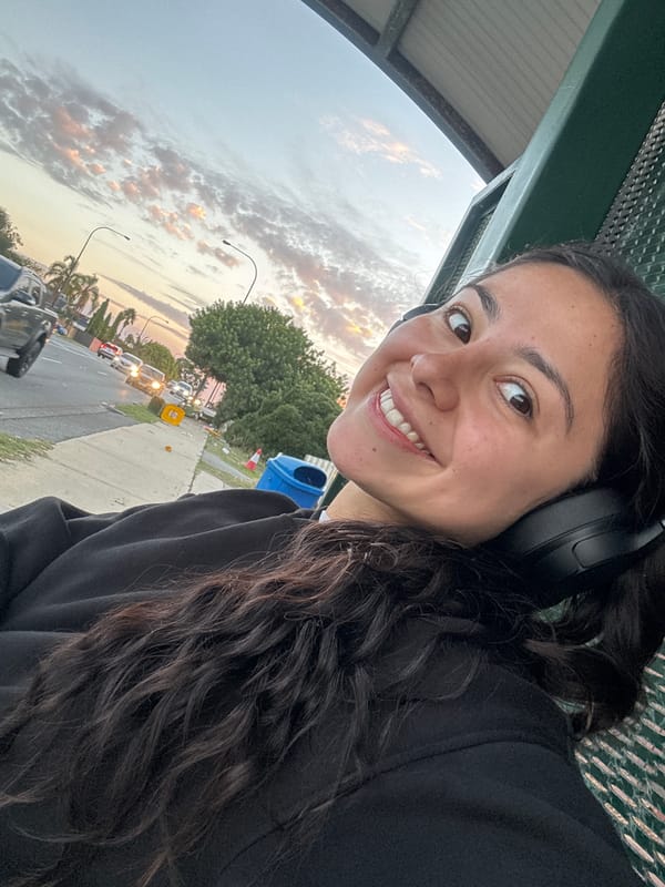 Woman photographed at Como bus shelter during evening hours