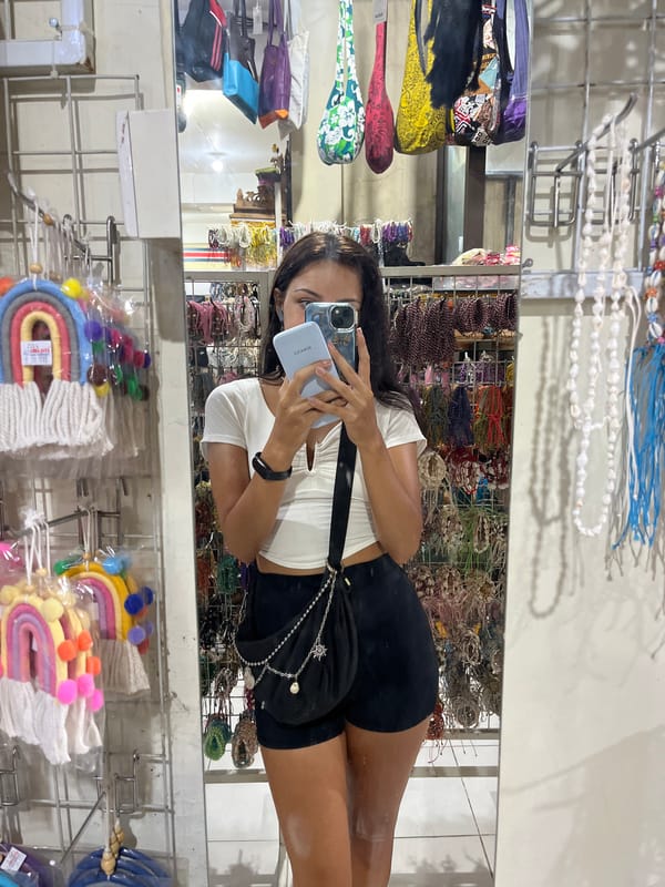 Woman shops and takes selfies at craft store in Indonesia