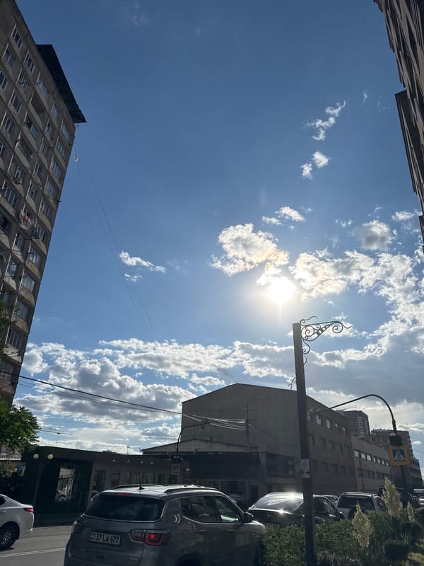 Urban scenes and parked vehicles in Armenian city