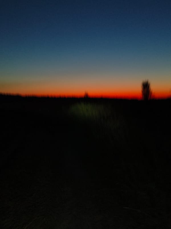 Slow dirt-path ride at sunset, sky going full orange