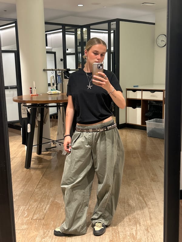 Person takes selfies in Whistler retail store early morning