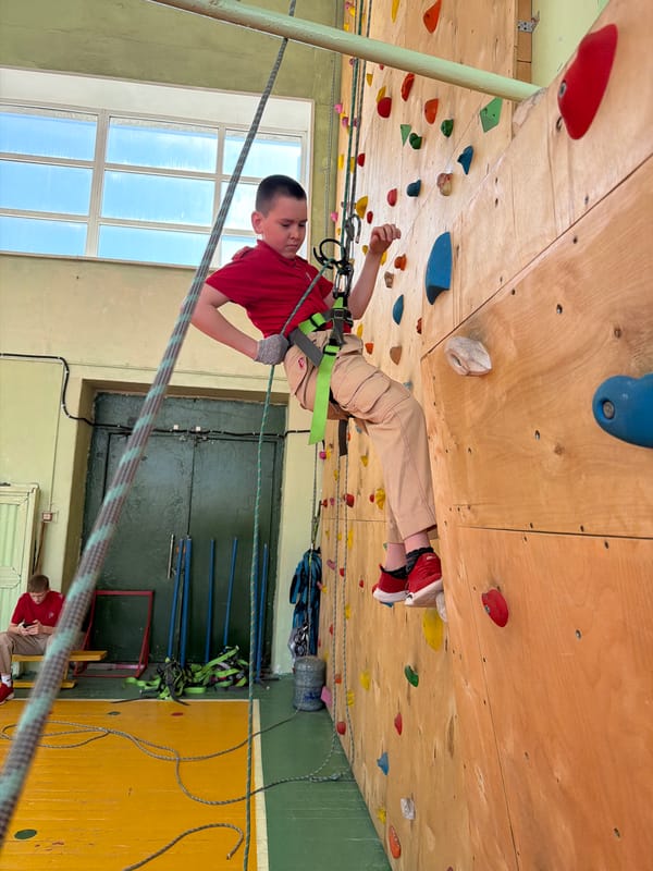 Children practice indoor rock climbing at Izhevsk center