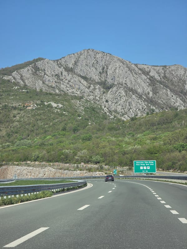 Highway rest area sign spotted on mountain road in Montenegro