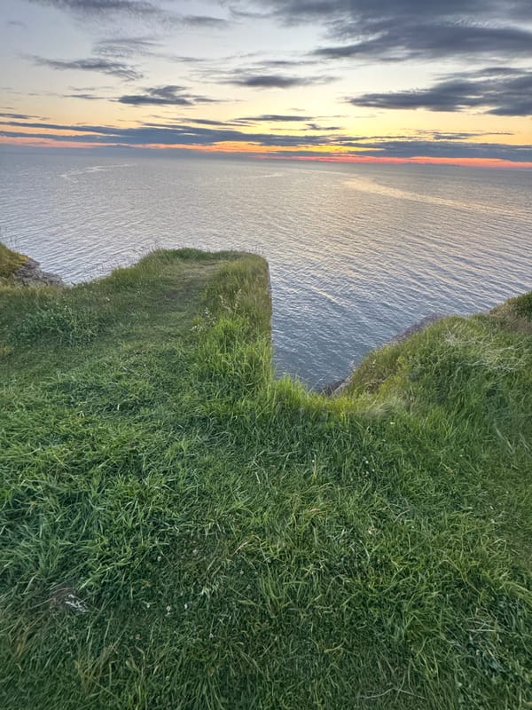 Estonian coastal clifftops and lighthouse at golden hour