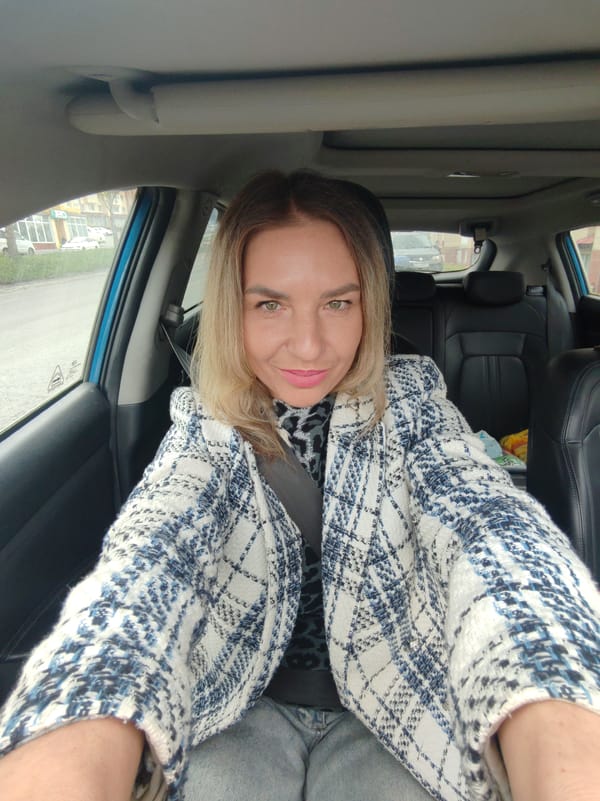 Woman takes car selfies in Petropavlovsk-Kamchatsky