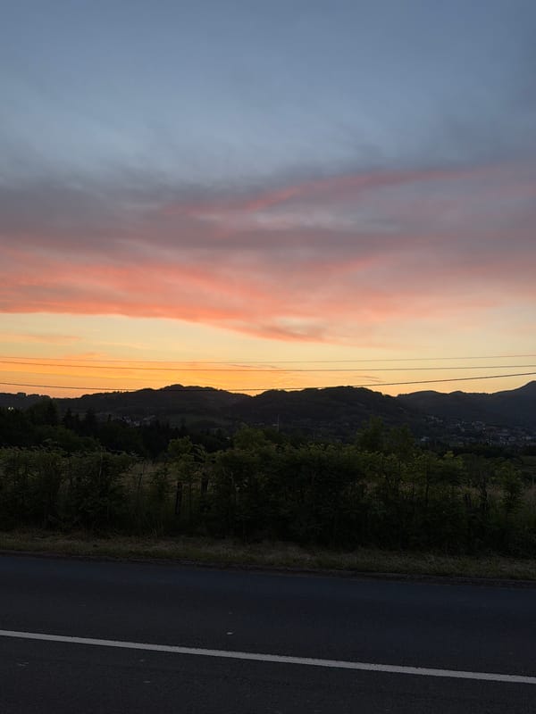 Dawn cyclist crosses pedestrian walkway in Errenteria, Spain