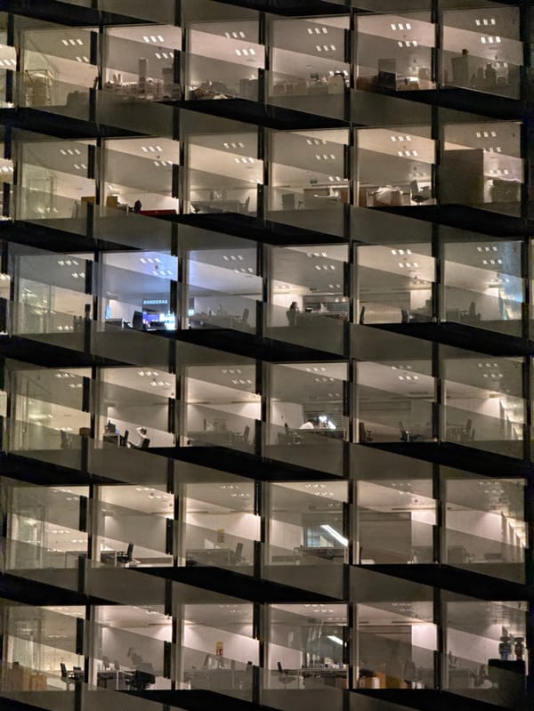 Office buildings illuminate evening grid in l'Hospitalet de Llobregat