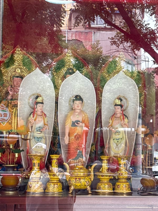 Buddhist shop displays and street life in Linghe, China