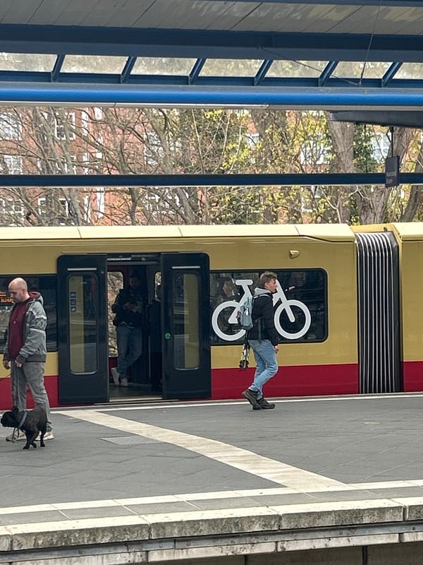 S-Bahn train stops at Berlin platform with passengers present