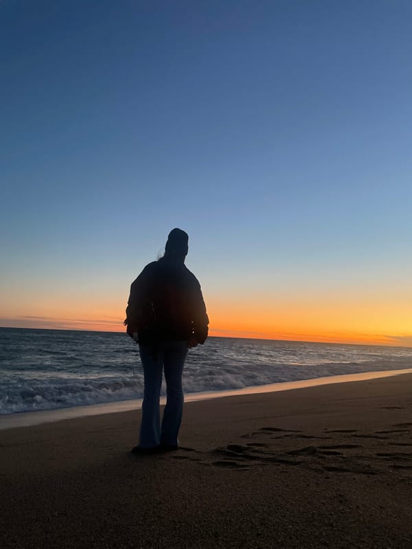 Sunset beach activity captured in Calella, Spain