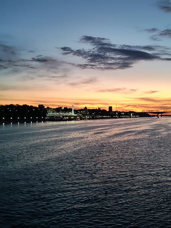 Sunset on the river and small-town details in Rusanovo