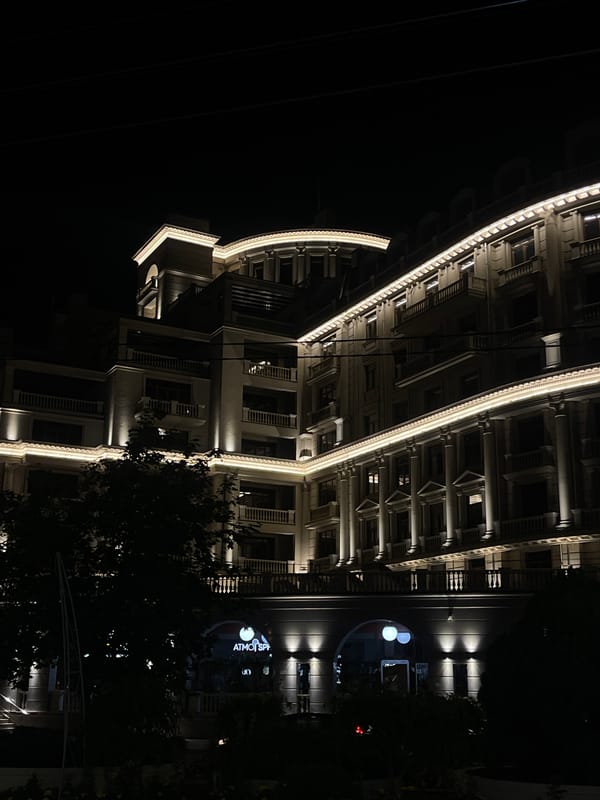 Evening illumination captures central Tiraspol's commercial district architecture