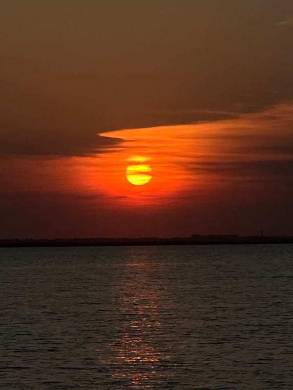 Golden sunset reflects across a Kokshetau lakeside